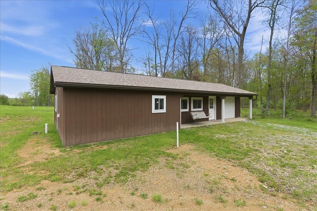 261 Hilltop Acres Road Slippery Rock, PA 16057 - Photo 3 of 35 a view of a house with a backyard