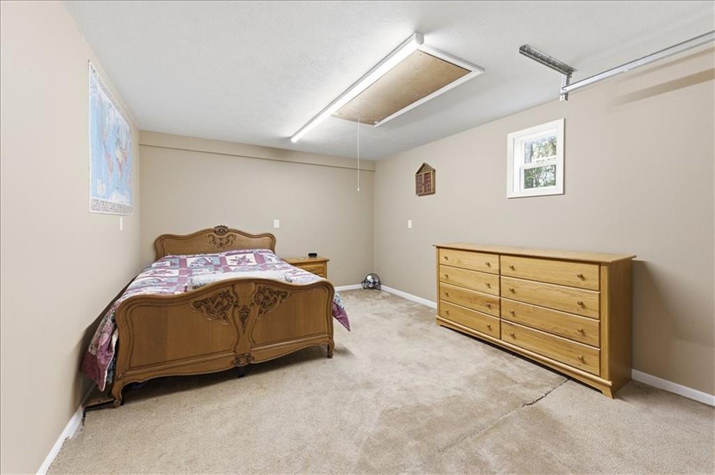 261 Hilltop Acres Road Slippery Rock, PA 16057 - Photo 7 of 35 a spacious bedroom with a bed and a cabinets