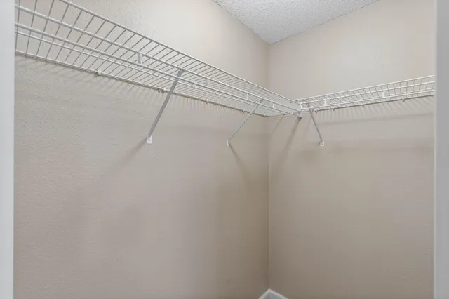 a view of a room with racks on the wall