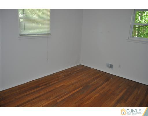 16 Donald Road East Brunswick, NJ 08816 - Photo 17 of 25 a view of an empty room and window