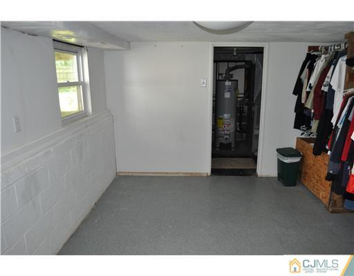 16 Donald Road East Brunswick, NJ 08816 - Photo 18 of 25 a view of an empty room with closet and windows