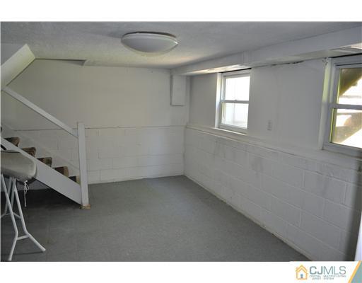 16 Donald Road East Brunswick, NJ 08816 - Photo 19 of 25 a view of an empty room with a window