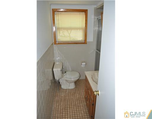 16 Donald Road East Brunswick, NJ 08816 - Photo 20 of 25 a bathroom with a toilet and a sink