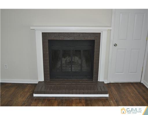 16 Donald Road East Brunswick, NJ 08816 - Photo 23 of 25 a living room with a fireplace