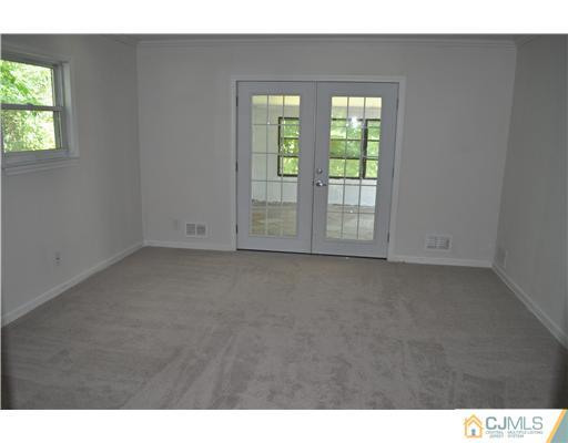 16 Donald Road East Brunswick, NJ 08816 - Photo 6 of 25 a view of empty room with window