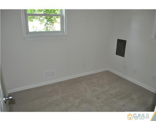 16 Donald Road East Brunswick, NJ 08816 - Photo 7 of 25 a view of an empty room with a window