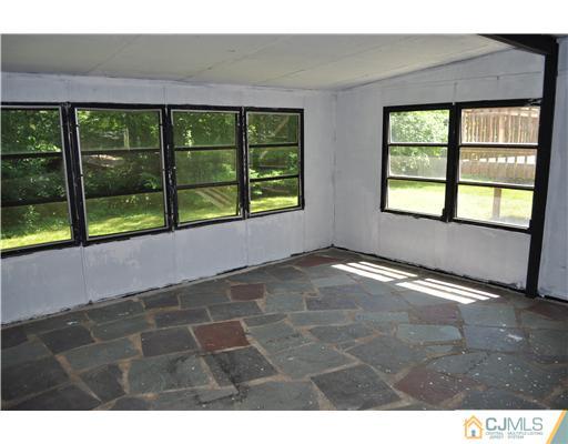 16 Donald Road East Brunswick, NJ 08816 - Photo 8 of 25 a view of an empty room with a window