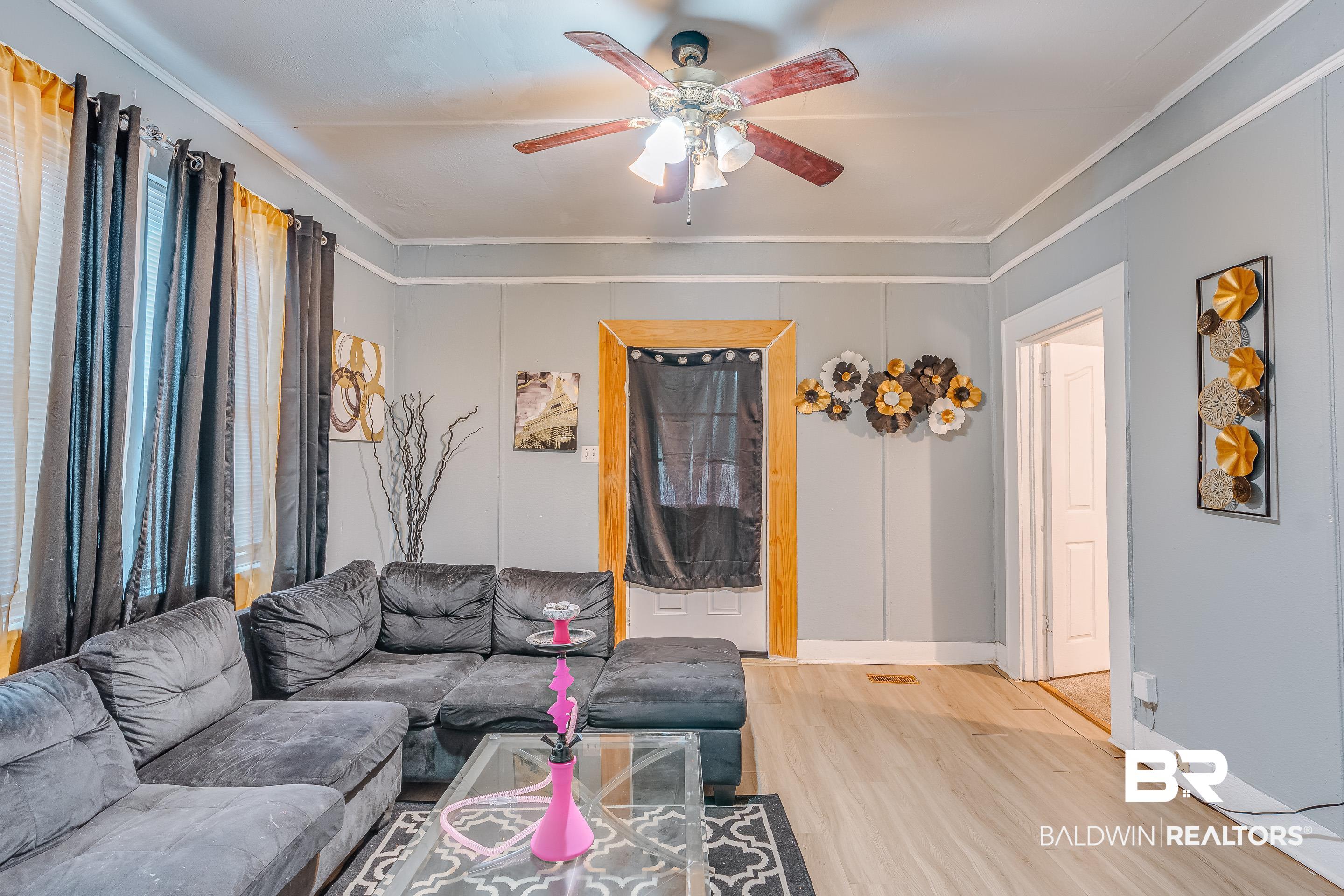 14 Southern Street Mobile, AL 36611 - Photo 5 of 26 Living room featuring ornamental molding, light hardwood / wood-style floors, and ceiling fan