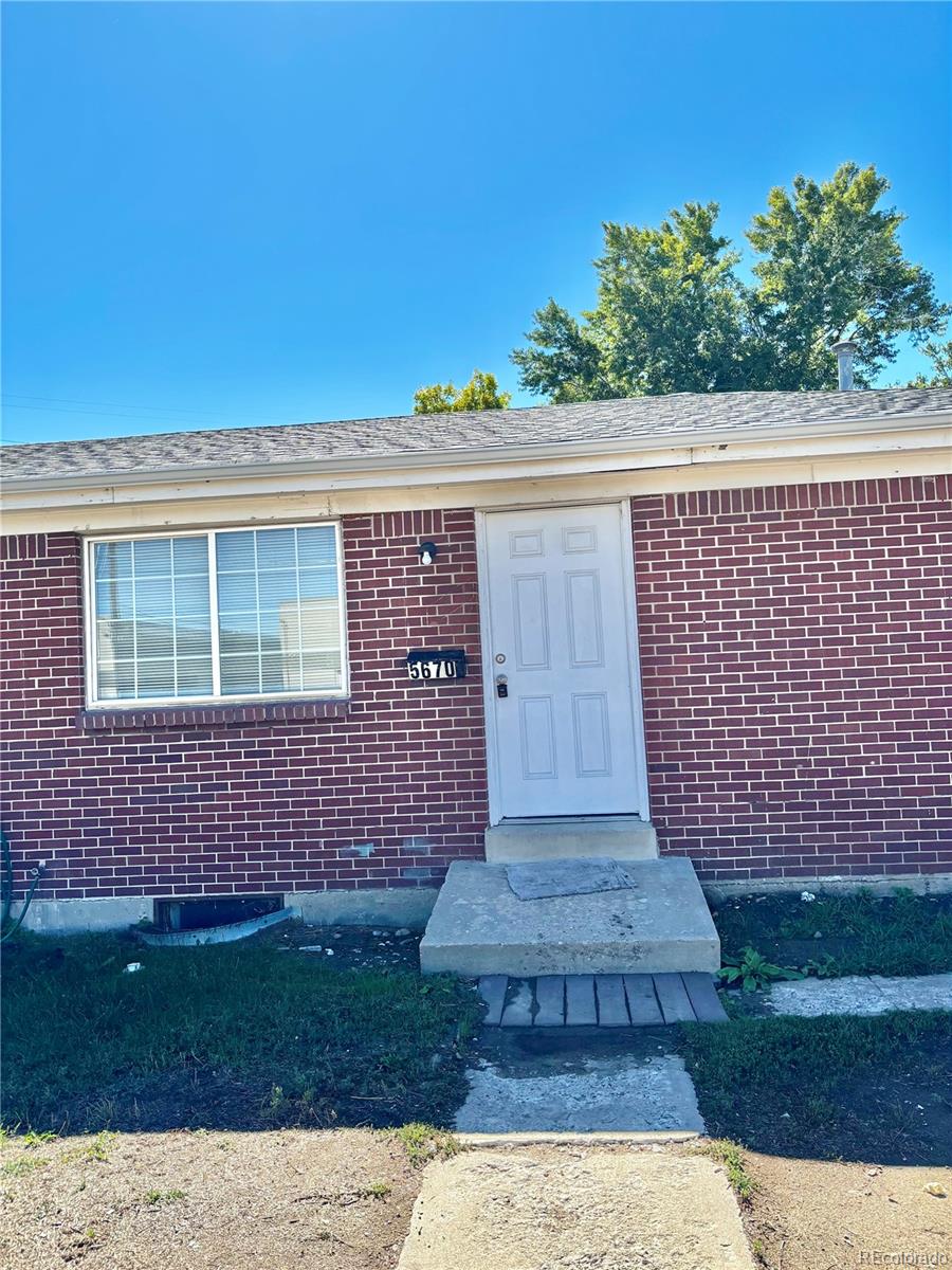 front view of a house with a garden