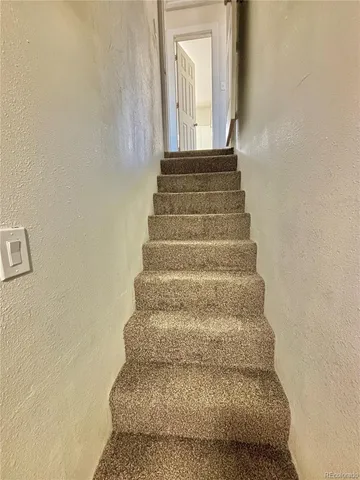 an empty room with a fan
