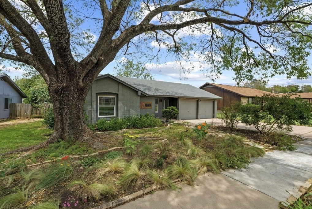 4712 Carsonhill Drive Austin, TX 78723 - Photo 1 of 1 a view of a house with a yard