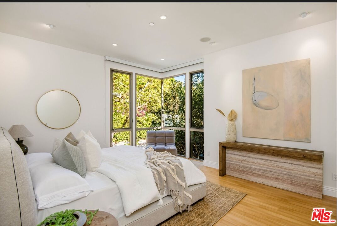 3685 Mandeville Canyon Road Los Angeles, CA 90049 - Photo 12 of 24 a bed room with a bed and a window