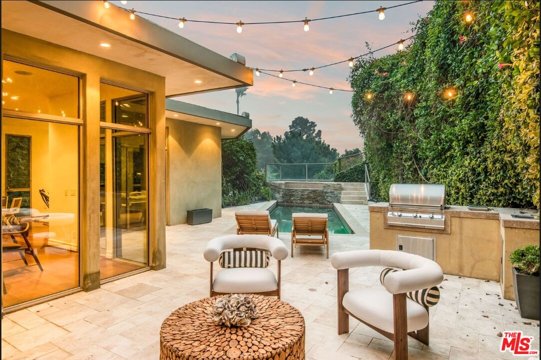 3685 Mandeville Canyon Road Los Angeles, CA 90049 - Photo 20 of 24 a outdoor space with patio furniture