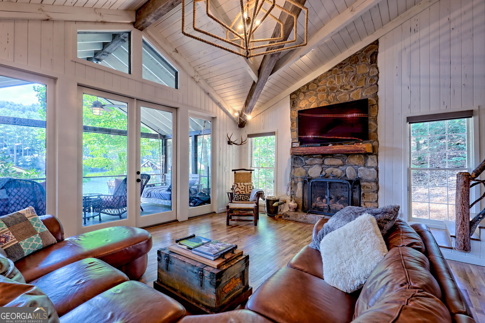 22 Cajun Loop Clayton, GA 30525 - Photo 13 of 87 a living room with furniture a fireplace a flat screen tv and large windows