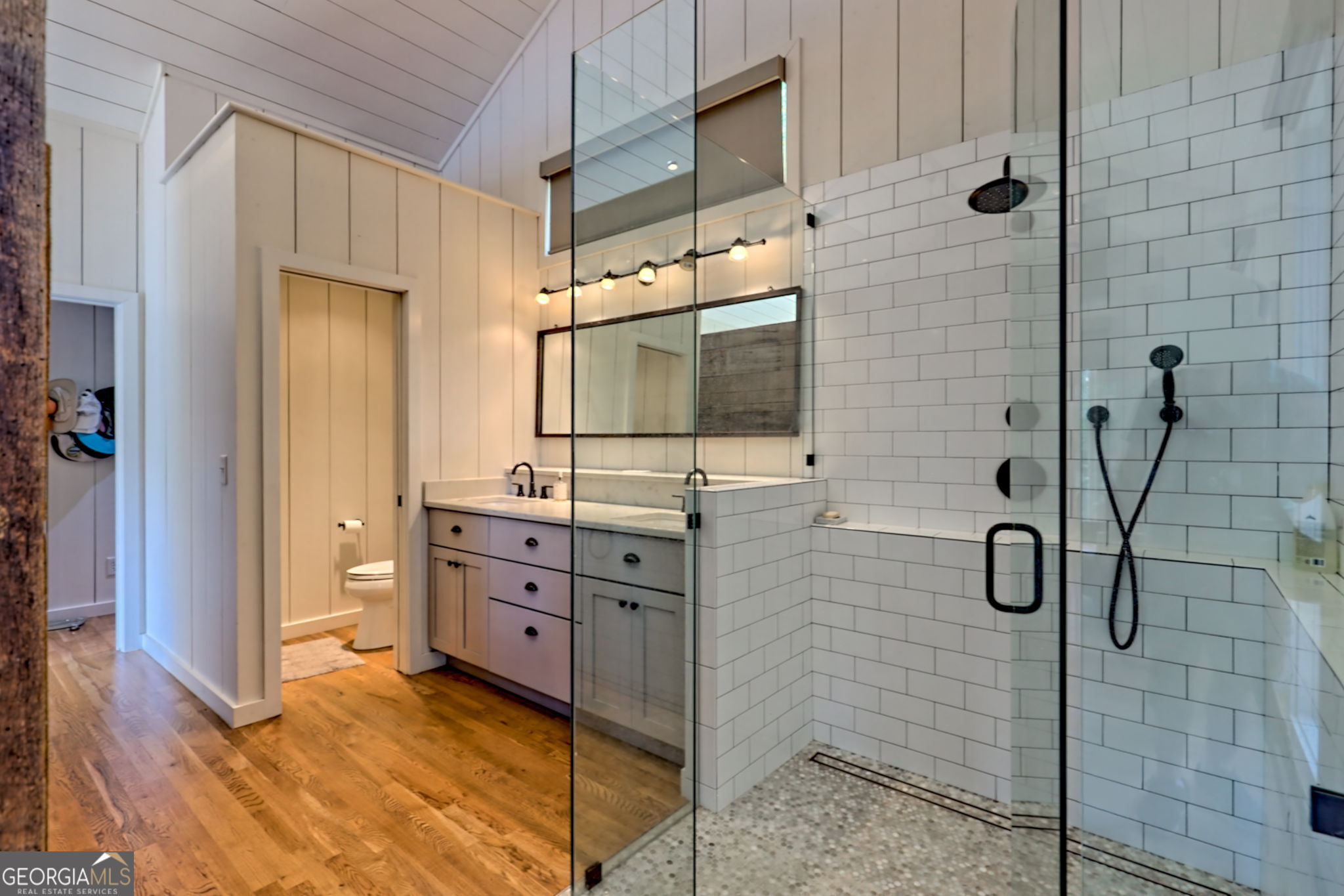 22 Cajun Loop Clayton, GA 30525 - Photo 27 of 87 a bathroom with a granite countertop sink a mirror and shower