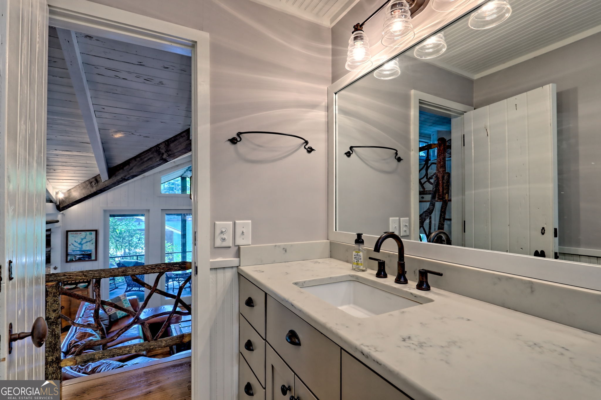 22 Cajun Loop Clayton, GA 30525 - Photo 39 of 87 a bathroom with a sink and a mirror