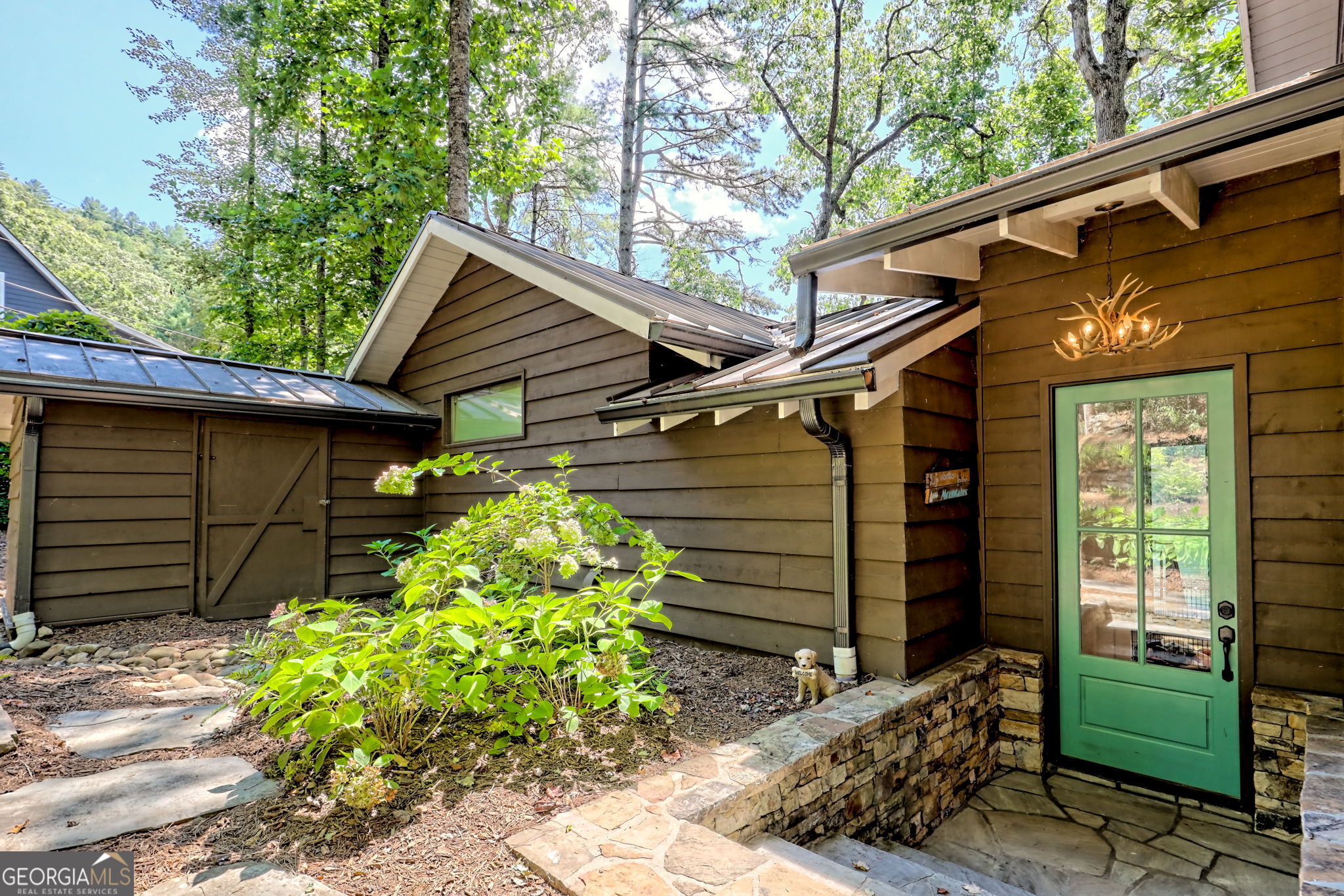22 Cajun Loop Clayton, GA 30525 - Photo 4 of 87 a backyard of a house with potted plants and a bench