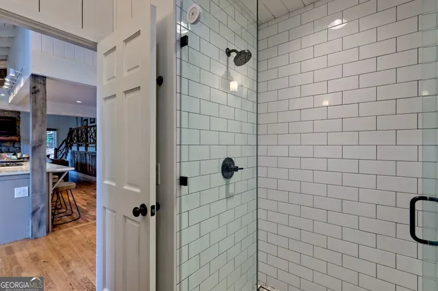 a view of a wooden house with a tree front of house