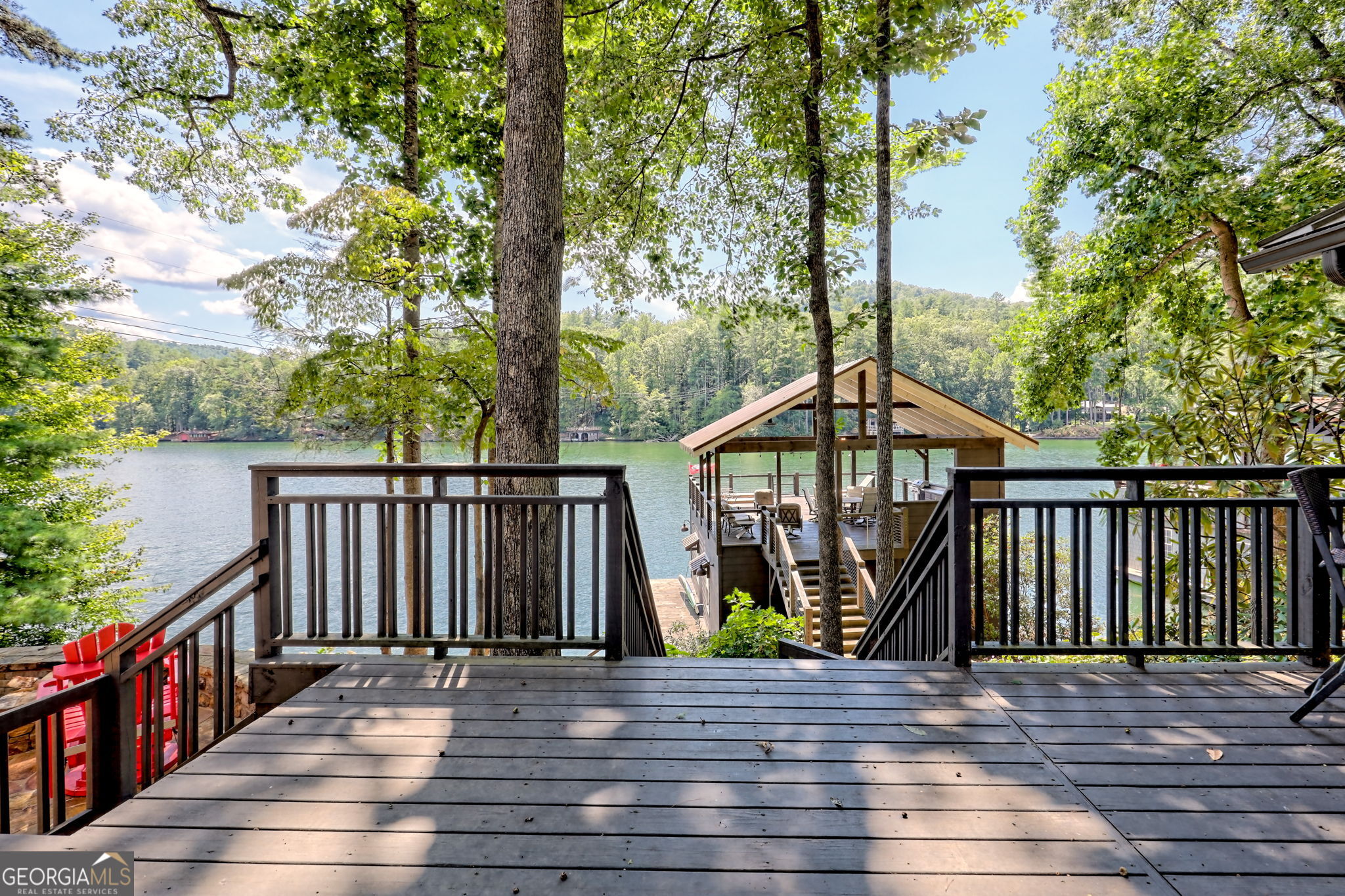 22 Cajun Loop Clayton, GA 30525 - Photo 52 of 87 a view of a deck with wooden floor and fence next to a yard
