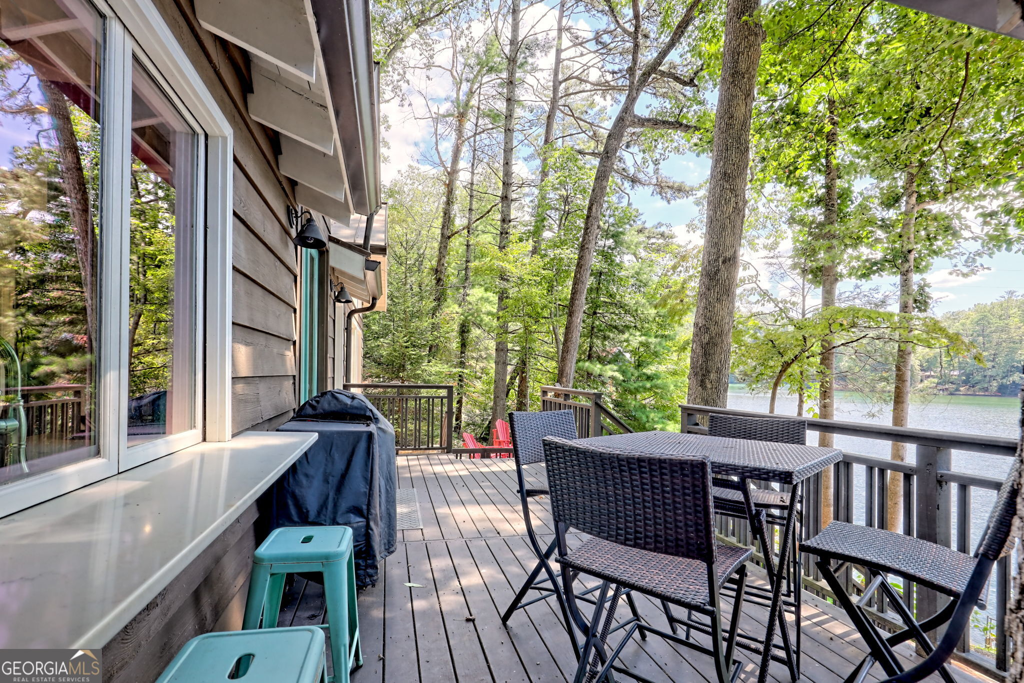 22 Cajun Loop Clayton, GA 30525 - Photo 59 of 87 a view of a patio with table and chairs and couches with wooden floor and fence