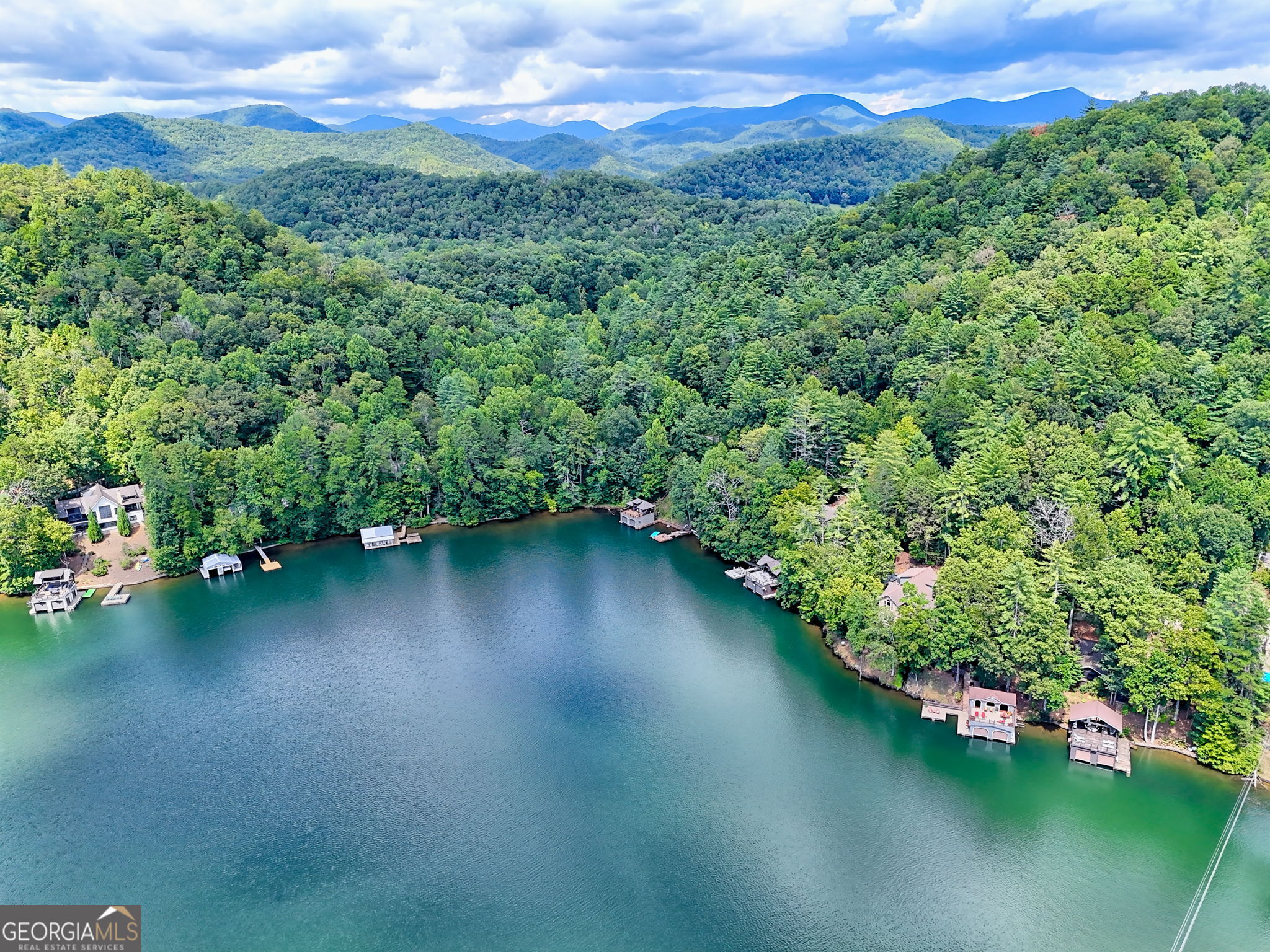 22 Cajun Loop Clayton, GA 30525 - Photo 81 of 87 an aerial view of a golf course with a lake