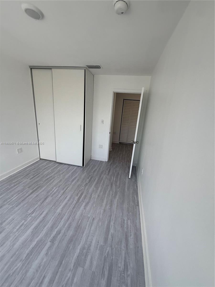 13984 Southwest 259th Street, Unit 13984 Homestead, FL 33032 - Photo 13 of 67 a view of hallway with wooden floor