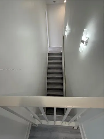 a bathroom with a shower and toilet