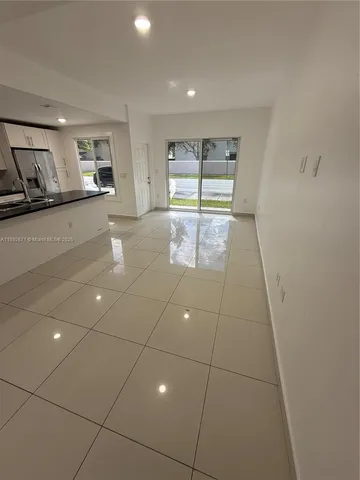 a kitchen with stainless steel appliances a sink stove and cabinets