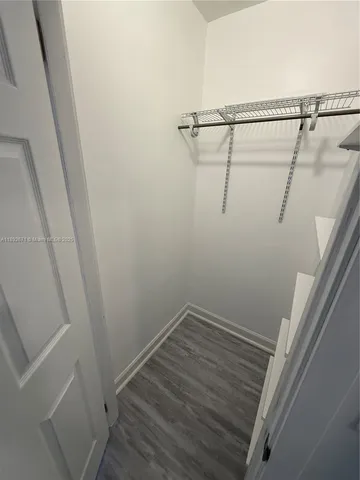 a view of a bathroom with a sink and mirror