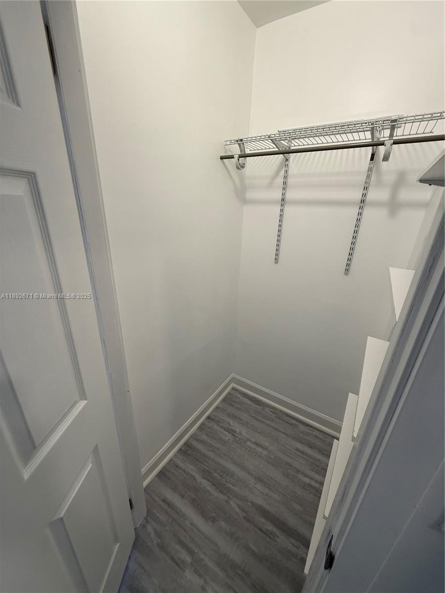 13984 Southwest 259th Street, Unit 13984 Homestead, FL 33032 - Photo 29 of 67 a view of a room with racks on the wall