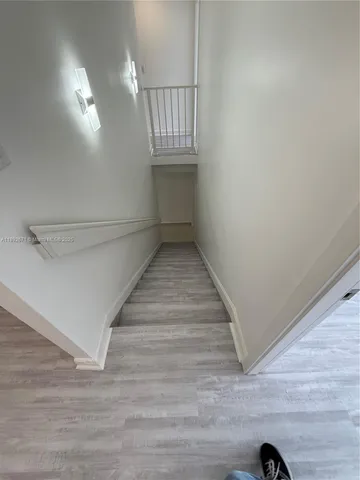 a view of a livingroom with an empty space and a window