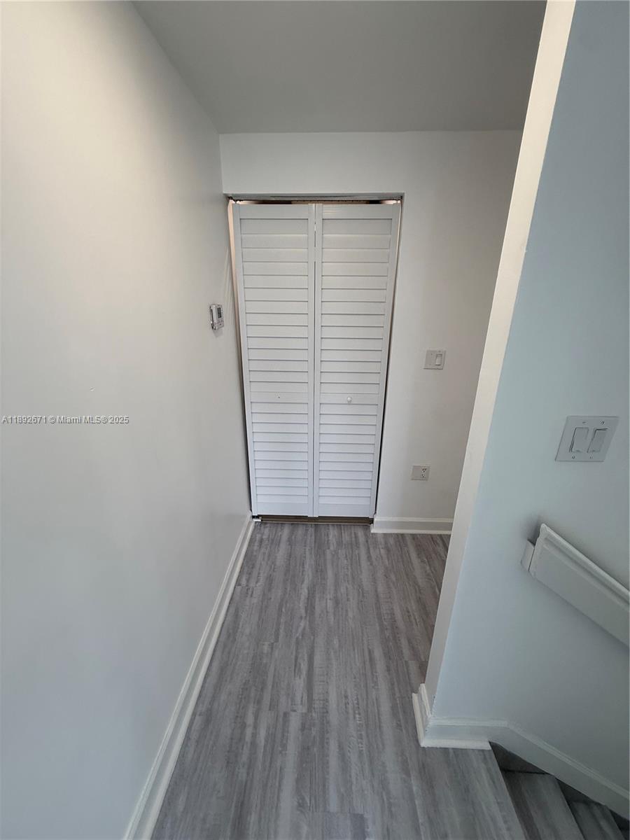13984 Southwest 259th Street, Unit 13984 Homestead, FL 33032 - Photo 41 of 67 wooden floor in an empty room with a window