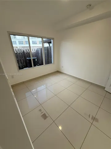 a kitchen with stainless steel appliances a sink a stove a microwave and cabinets