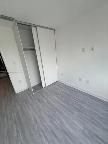 a kitchen with a sink a stove and cabinets