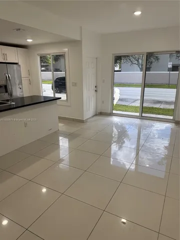 a view of utility room with wooden floor