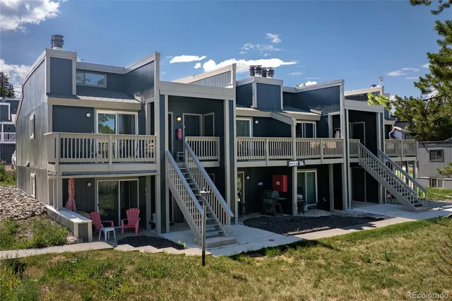 a view of a house with swimming pool and porch
