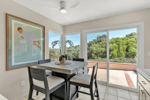 a kitchen with a sink a stove top oven and white stainless steel appliances