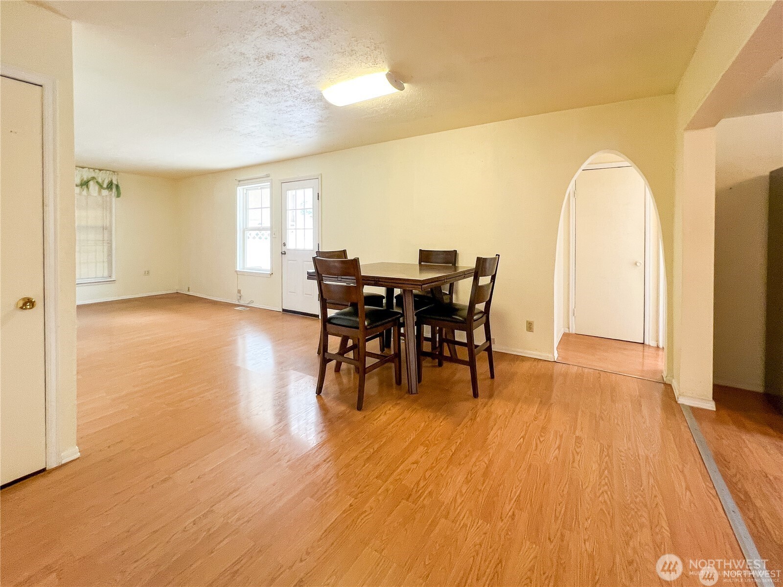 518 Edson Street Lynden, WA 98264 - Photo 11 of 31 a view of a dining room with furniture and wooden floor