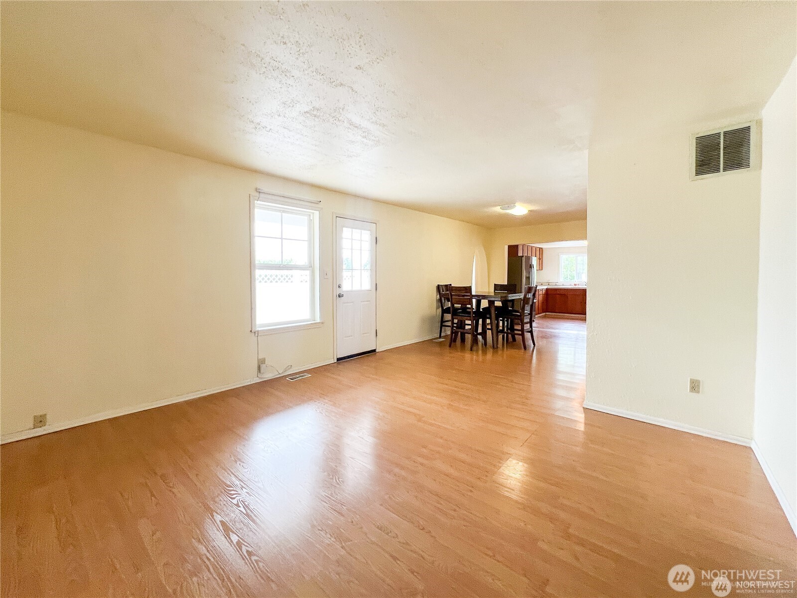 518 Edson Street Lynden, WA 98264 - Photo 12 of 31 a view of a dining room with furniture and wooden floor