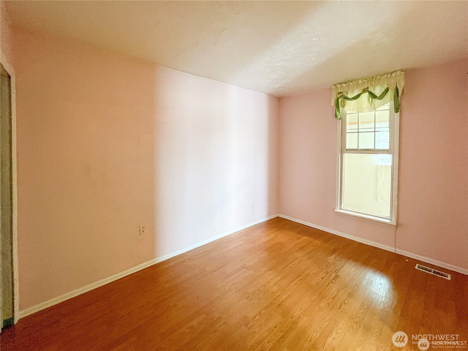 518 Edson Street Lynden, WA 98264 - Photo 18 of 31 a view of an empty room with a window