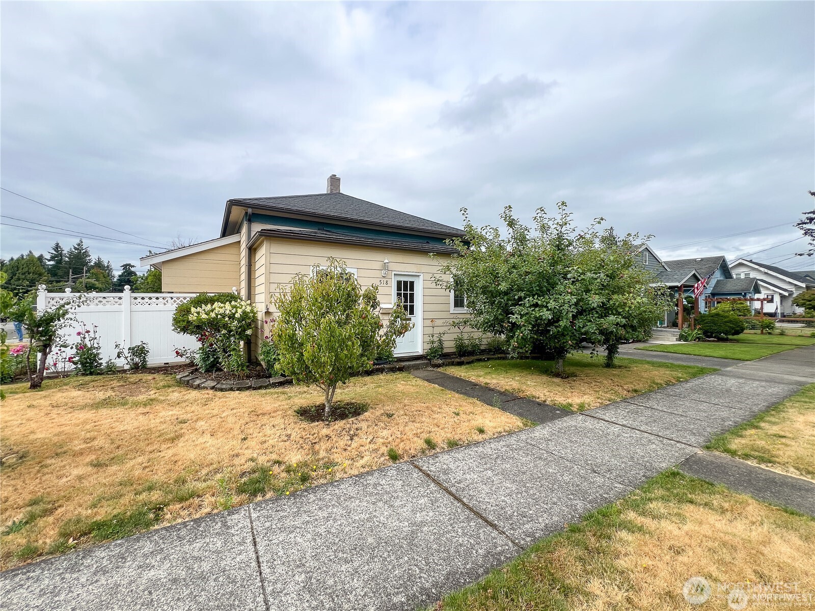 518 Edson Street Lynden, WA 98264 - Photo 25 of 31 a view of a house with small yard plants and palm trees