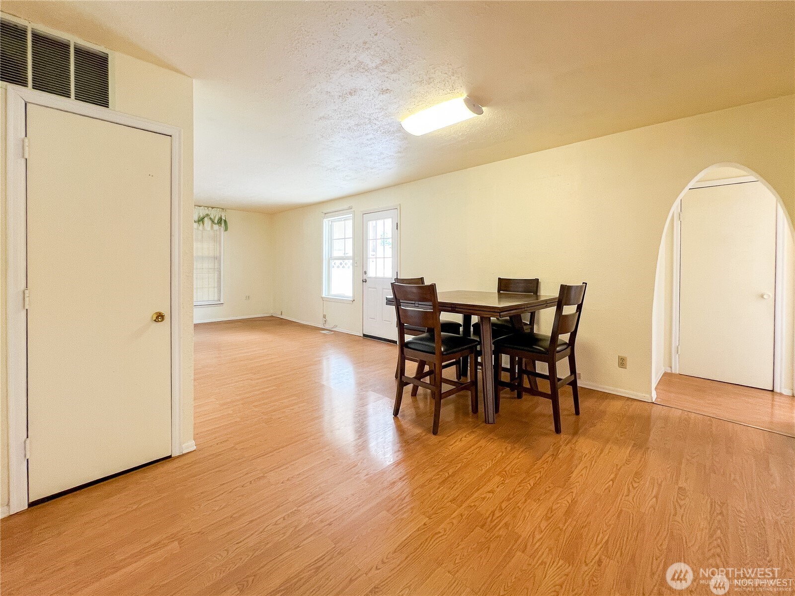 518 Edson Street Lynden, WA 98264 - Photo 10 of 31 a view of a dining room with furniture and wooden floor