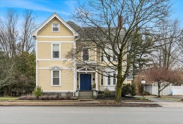 a front view of a house with a yard