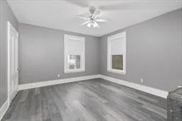 a bedroom with a bed and a potted plant