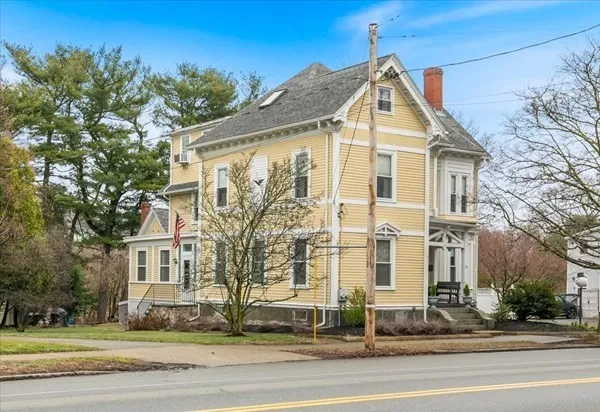 a front view of a house with a yard