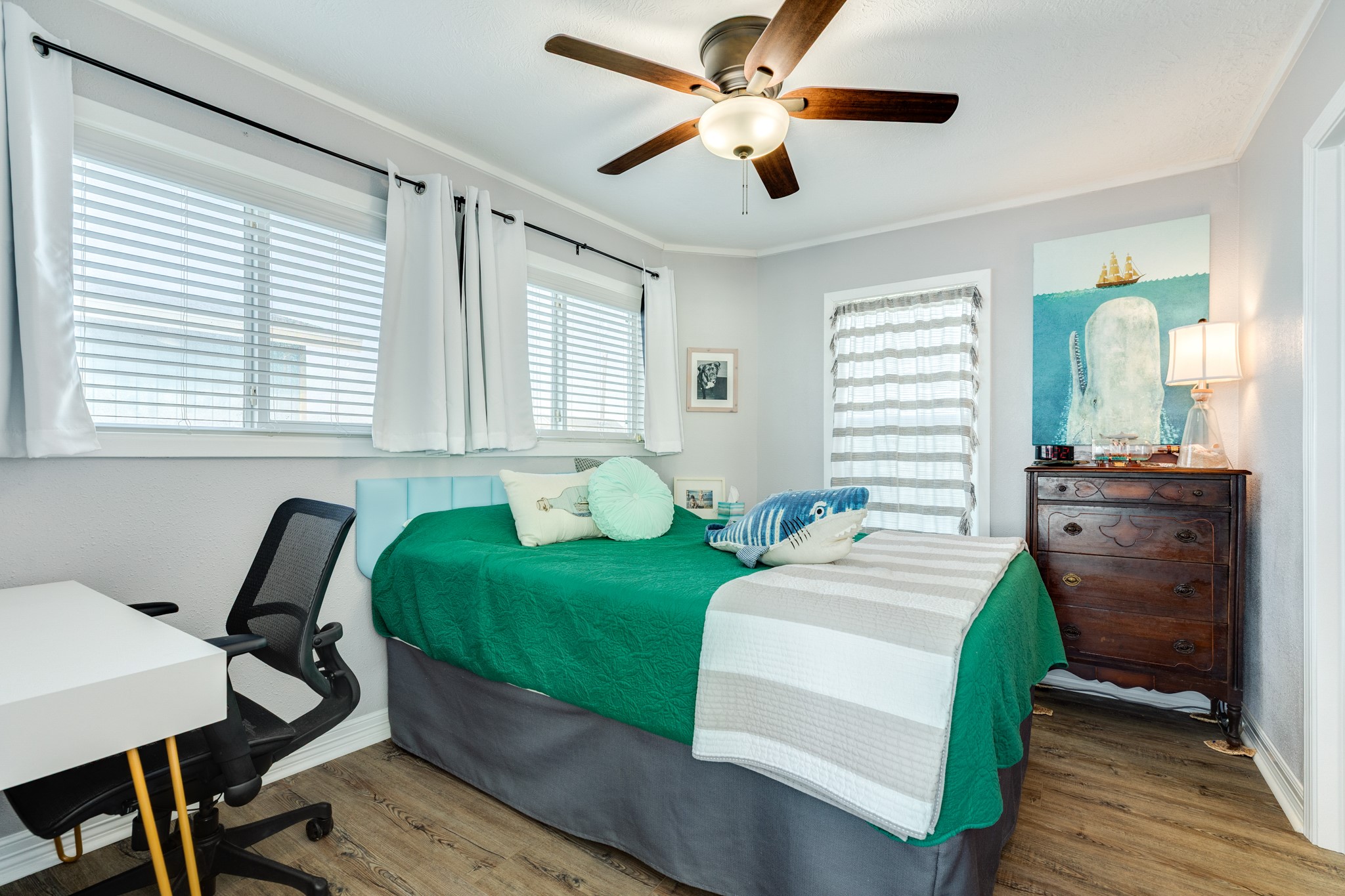 722 Beach Drive Surfside Beach, TX 77541 - Photo 15 of 34 a bedroom with a bed and wooden floor