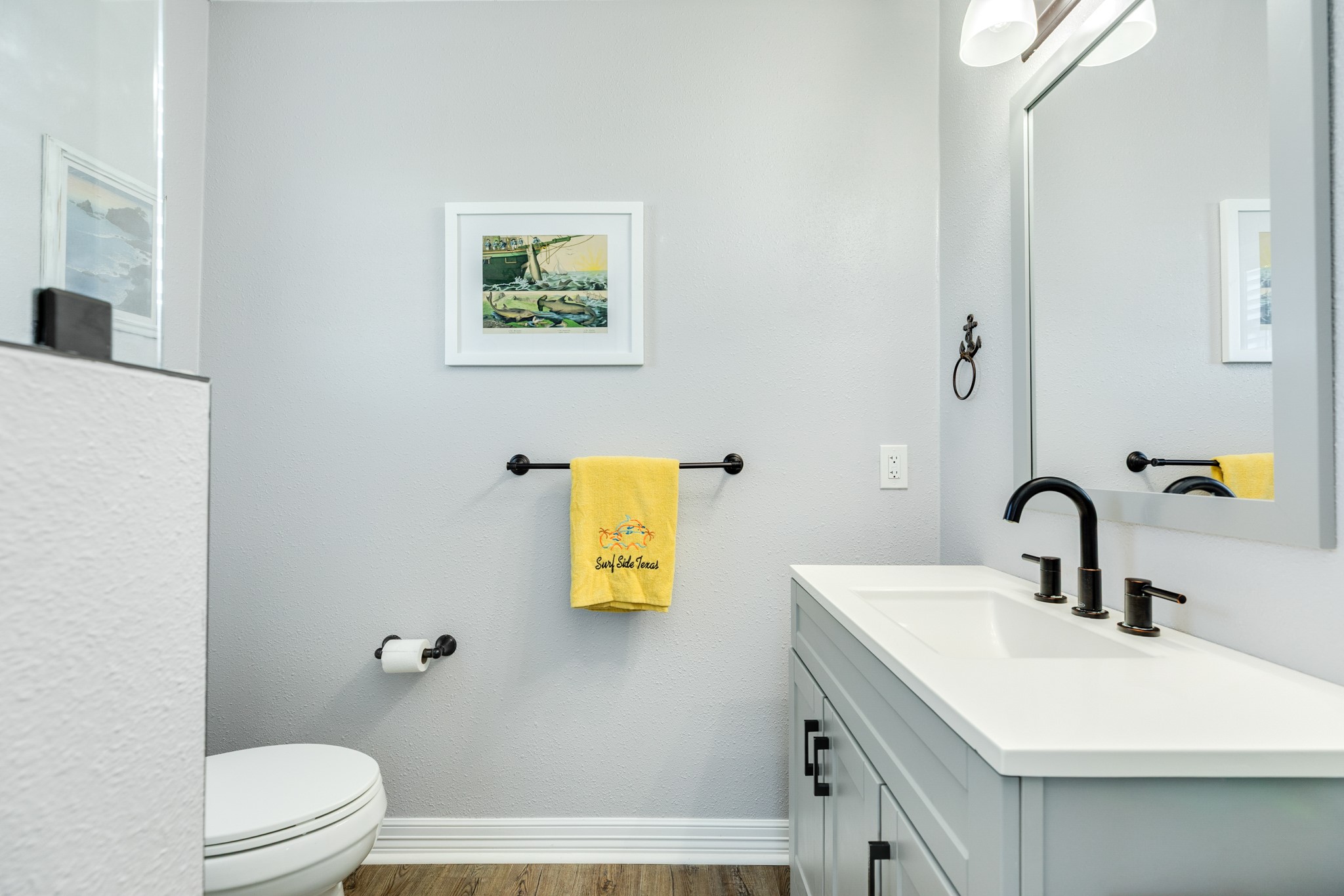 722 Beach Drive Surfside Beach, TX 77541 - Photo 16 of 34 a bathroom with a sink mirror and toilet