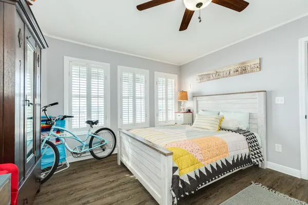 a bed sitting in a bedroom next to a window