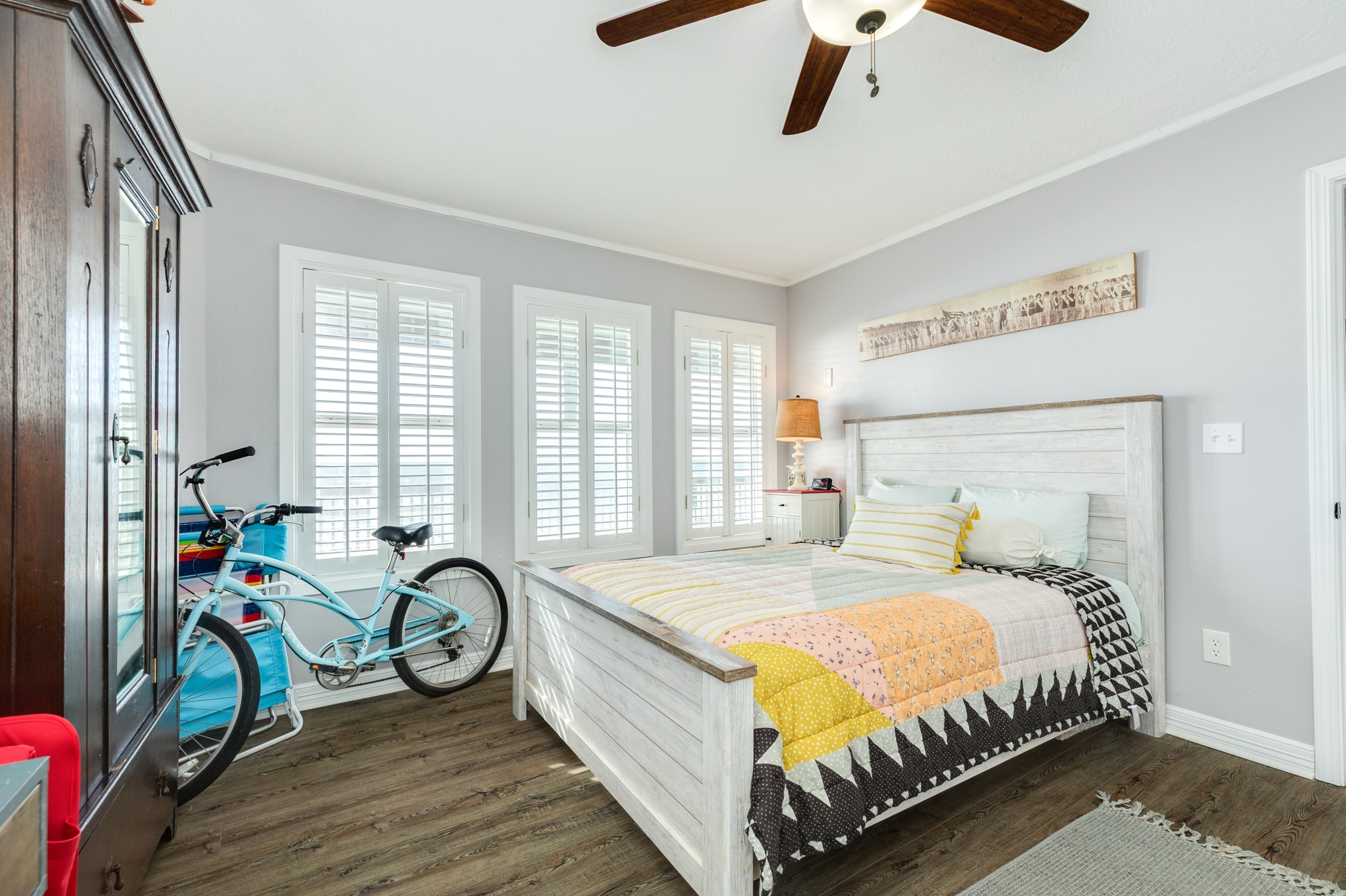 722 Beach Drive Surfside Beach, TX 77541 - Photo 18 of 34 a bed sitting in a bedroom next to a window