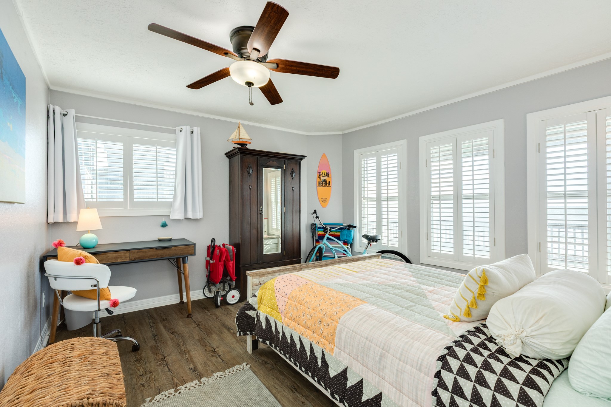 722 Beach Drive Surfside Beach, TX 77541 - Photo 19 of 34 a bedroom with a bed and wooden floor